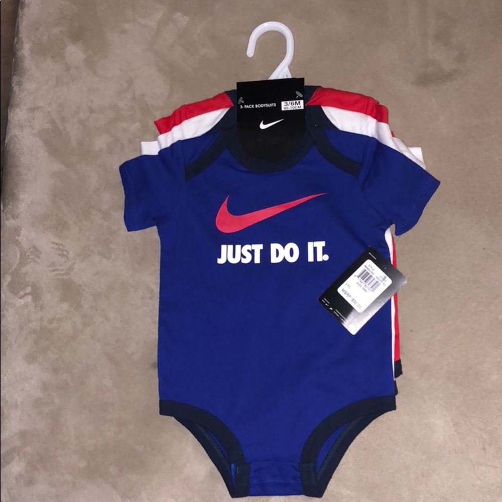 Puma and Nike, a total of 8 bodysuits size 3-6 mon